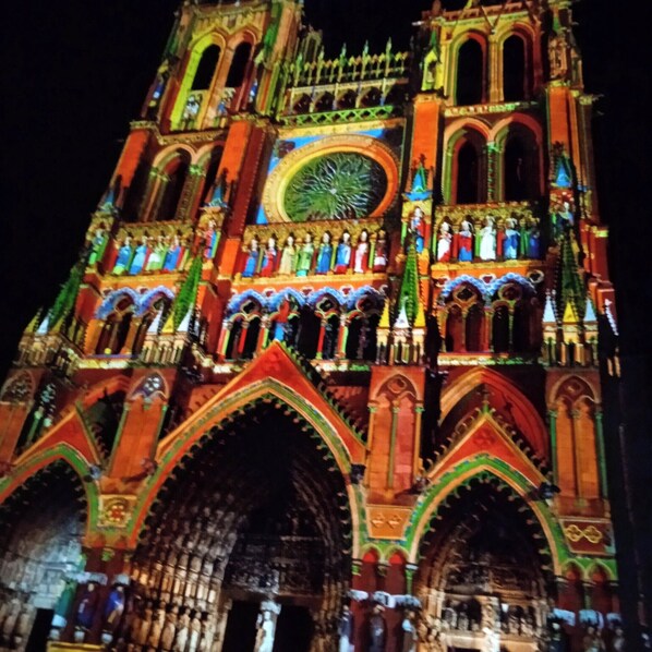 A large, ornate cathedral with multiple arched windows and intricate architectural details.