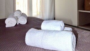 A hotel room with a bed, a window with sheer curtains, and a view of the outdoors. - Sweet Emily, Panoramic comfort just a stone's throw from Sorrento! (Sant'Agnello)