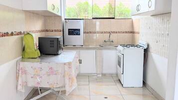 Fridge, microwave, electric kettle, cookware/dishes/utensils