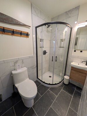 Shower, eco-friendly toiletries, hair dryer, towels