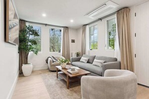 Executive Apartment, 2 Bedrooms, Balcony, Mountain View | Living area | 65-inch Smart TV with digital channels, Netflix, Hulu - Casa Riviera (Santa Barbara)