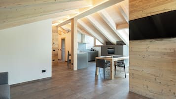 Deluxe three-room apartment (attic) | Living area | Flat-screen TV