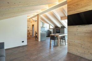 Deluxe three-room apartment (attic) | Living area | Flat-screen TV