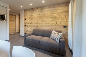 Superior three-room apartment first floor | Living area | Flat-screen TV