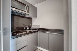 Fridge, microwave, stovetop, coffee/tea maker