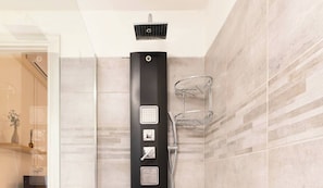 Shower, hair dryer, towels, shampoo