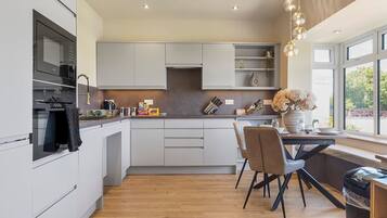 Fridge, oven, dishwasher, dining tables