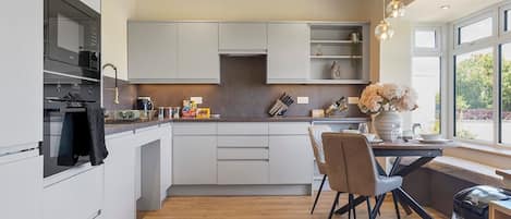 Fridge, oven, dishwasher, dining tables