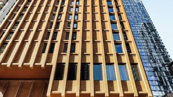 The Riu Plaza Toronto Hotel with a modern facade, large windows, and a prominent entrance.