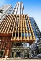 The Riu Plaza Toronto Hotel with a modern facade, large windows, and a prominent entrance.