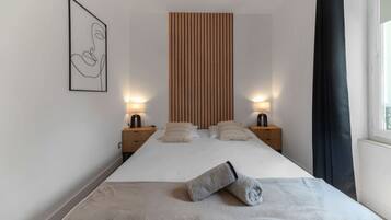 1 bedroom, desk, iron/ironing board, travel crib