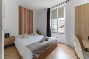 1 bedroom, desk, iron/ironing board, travel crib