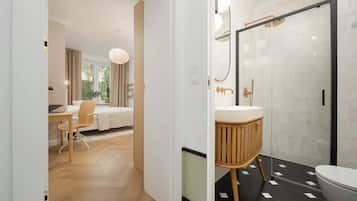 Shower, hair dryer, towels, shampoo