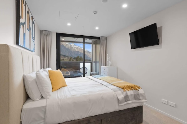 Rest easy in this inviting, mountain-view bedroom.