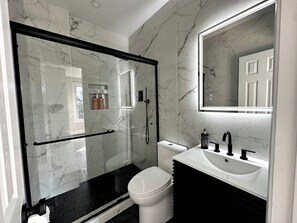 Shower, hair dryer, towels, soap