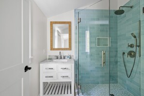 Shower, hair dryer, towels, soap