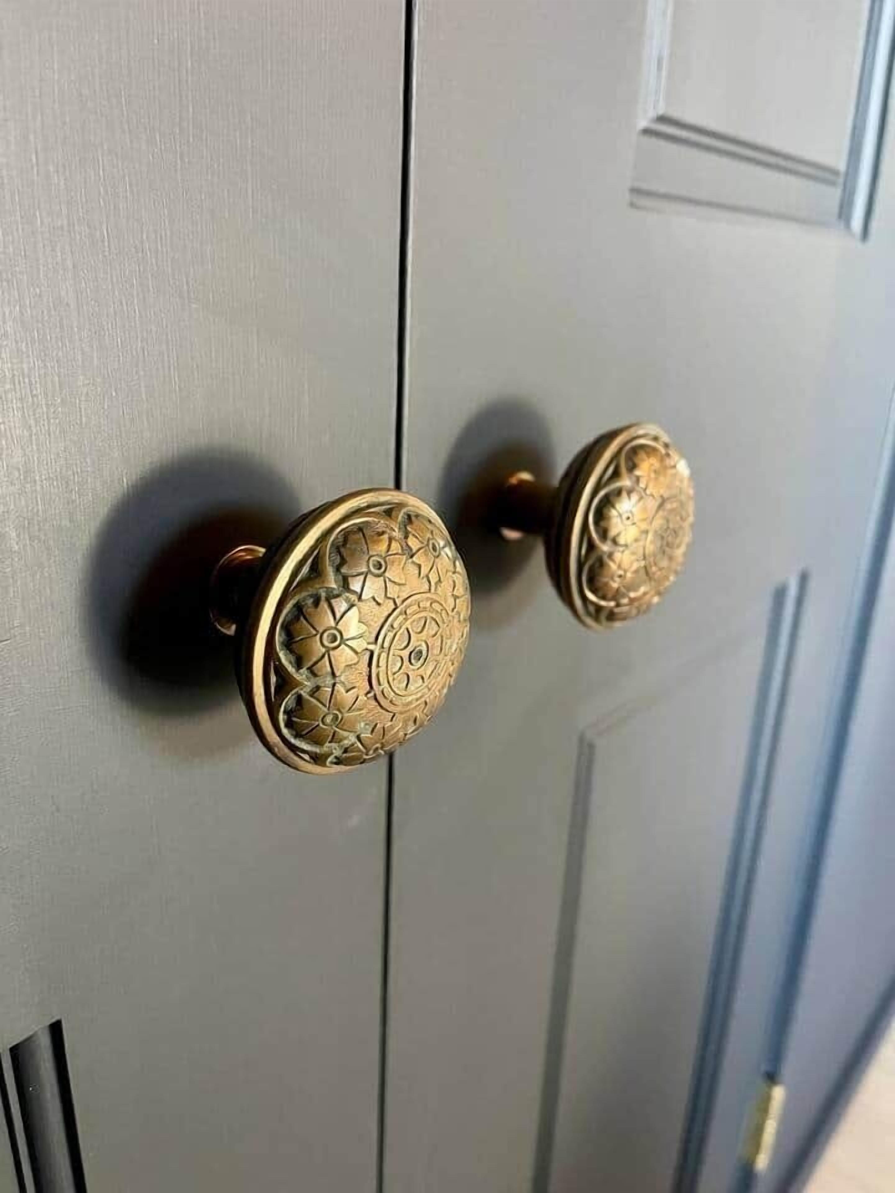 A door with two ornate brass handles.
