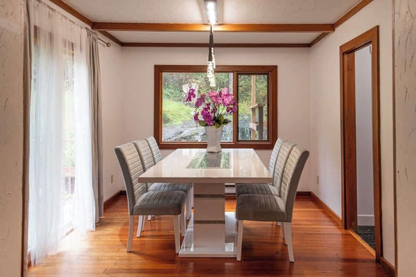 Enjoy meals with a view in the light-filled dining area, perfect for family gatherings.