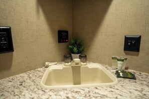 Shower, hair dryer, towels, shampoo