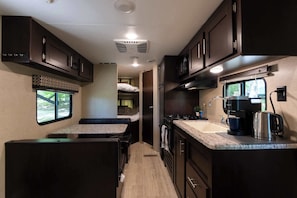 Coffee/tea maker, fridge, microwave, oven