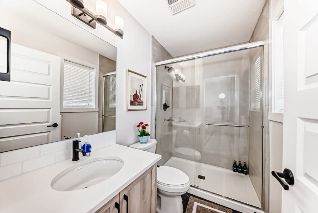 Shower, hair dryer, towels, soap. Cozy beautiful house
