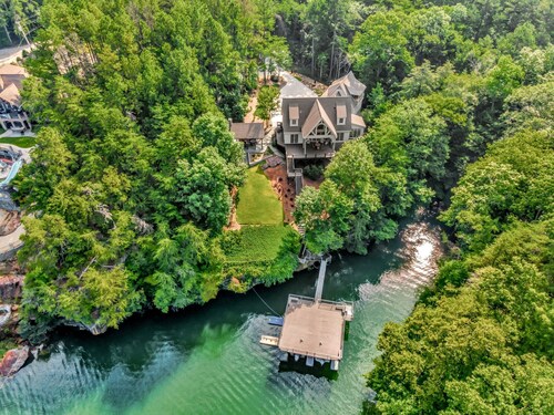 Charming 3-bedroom lake house with outdoor recreation space and a large dock.