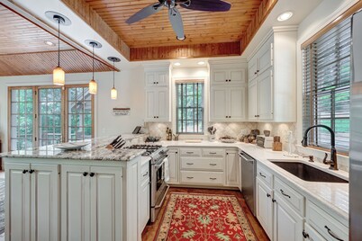 Charming 3-bedroom lake house with outdoor recreation space and a large dock.