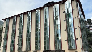 A multi-story building with large windows and balconies. - Torwal plaza and guest house  (Bahrain)