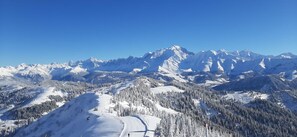 A snow-covered mountain landscape with a clear sky.
