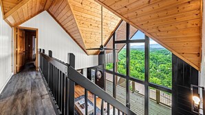 A high-ceilinged wooden interior with a view of a forested landscape. - 6 Bedroom VIEW next to Dollywood FLASH SALE today (Sevierville)