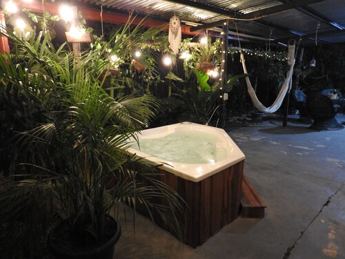 Charming 2-bedroom beach house in CR's only Blue Zone with AC, WiFi and Jacuzzi.