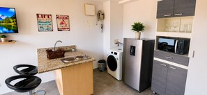 Standard Apartment, City View | Private kitchen | Full-size fridge, microwave, stovetop, rice cooker - Cold AC fast Wi-Fi great location  (Medellín)