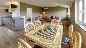 A compact living space with a kitchen, dining area, and seating area. - 2 bedroom beautiful home in Fleninge (Fleninge)