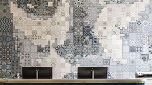 A reception desk with a patterned tile wall behind it. - Sleek Boutique Room in Nob Hill Near Wharf, Shops & Grace Cathedral (San Francisco)