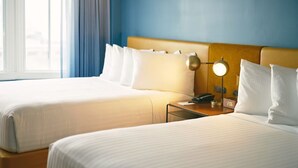 A hotel room with two beds, a nightstand with a lamp, and a window with curtains. - 2 King Room in San Francisco’s Nob Hill, Near Union Square & Attractions (San Francisco)