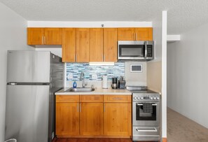 Microwave, toaster, blender, cookware/dishes/utensils