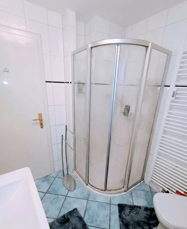 Hair dryer, slippers, towels, soap