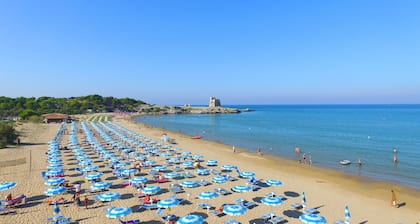 Property In A Holiday Village 'Monolocale Con Giardino' with Shared Pool and Air Conditioning