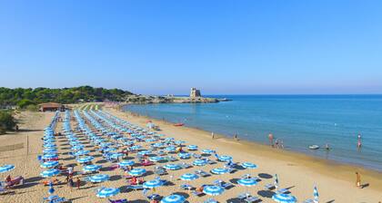 Property In A Holiday Village 'Monolocale Con Giardino' with Shared Pool and Air Conditioning