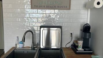 Fridge, microwave, coffee/tea maker, toaster