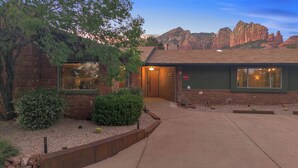 A rustic building with a stone facade, a wooden door, and a small porch area. - Escape to Sedona Demir Suite 205, a cozy 1-bed condo in vibrant Uptown Sedona! (Sedona)
