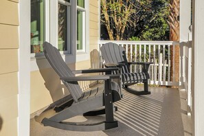 Two Adirondack chairs on a porch with a white railing. - Large Group Stay | Pool + Walk to Beach (Destin)