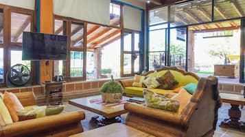 Family House, Balcony, Garden View | Living room | Flat-screen TV