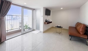 Panoramic Studio | Living area | 40-inch Smart TV with digital channels