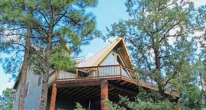 This is a luxurious two-story mountain retreat tucked in Ruidoso Downs, NM.