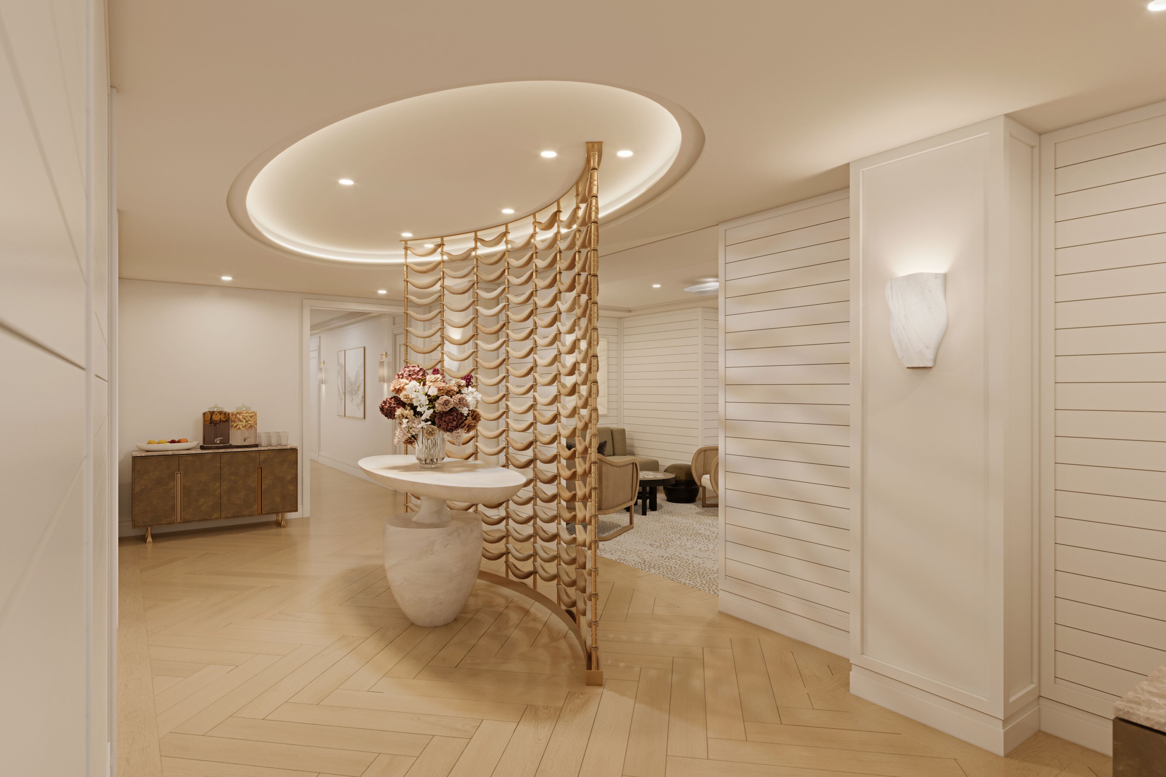 A modern interior with a curved wall, a round table with a vase, and a sofa in the background.