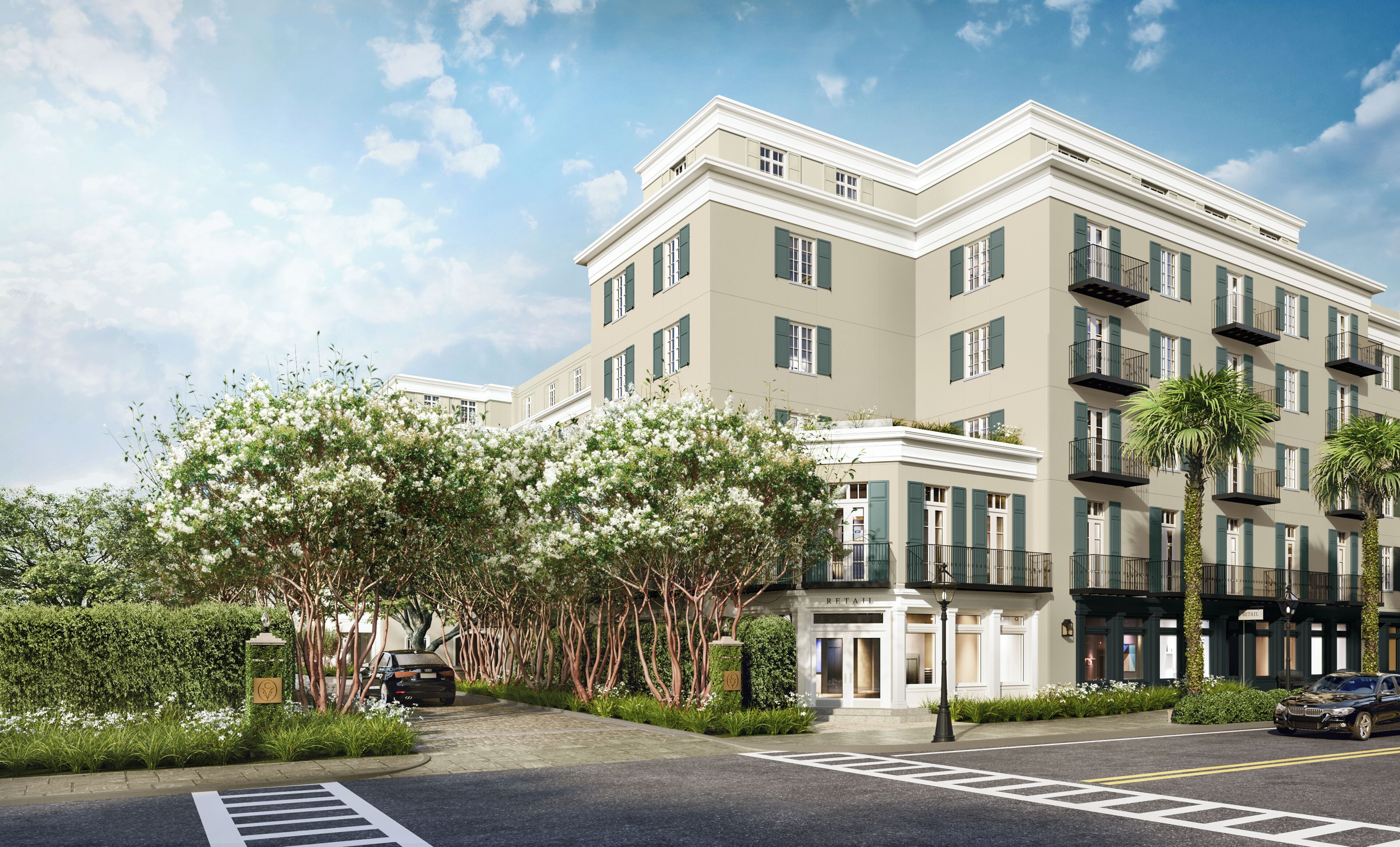 A multi-story hotel with a classic architectural design, featuring a central entrance, balconies, and a well-maintained garden area.