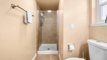 Shower, hair dryer, towels, shampoo