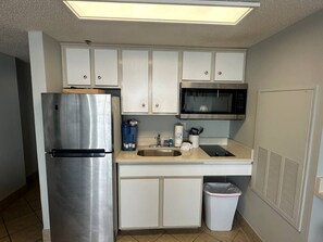 Fridge, microwave, stovetop, coffee/tea maker