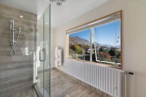 Shower, hair dryer, towels, shampoo